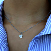 Aggie Shield™ diamond pendant necklace worn on the neck in white gold, featuring a shield-shaped lab grown diamond.